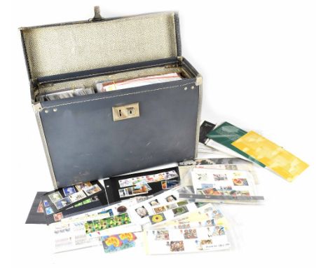 A vintage carrying case containing a large number of first day covers to include commemorative Roald Dahl examples, motorcycl