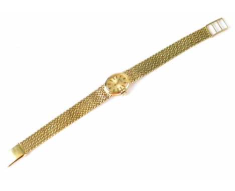 A ladies' vintage hallmarked 9ct gold Rotary 21 jewel wristwatch, the oval gold face with raised gold baton markers on a 9ct 