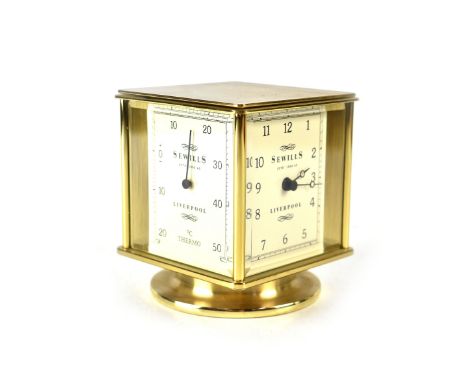 Sewills of Liverpool; a brass-cased weather station with clock, barometer, thermometer and hygro. CONDITION REPORT Appears in