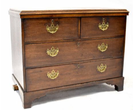 A George III oak chest of two short and two long drawers with pierced brass drop handles, on bracket feet, 79 x 100 x 49cm (a