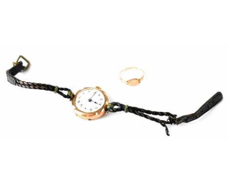 A vintage 9ct rose gold ladies' wristwatch, the white dial set with Arabic numerals to a plaited leather strap (strap af) and