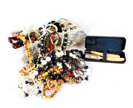 A quantity of ladies' costume jewellery, mainly necklaces to include faux pearl examples, glass beads, vintage clip-on earrin