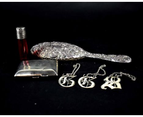 A hallmarked silver hand mirror, a cranberry perfume bottle with hallmarked silver top, marks rubbed, a hallmarked silver eng