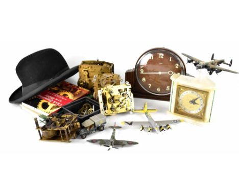 A quantity of clock mechanisms, various other clock parts to include pendulums, springs etc, three books relating to clock re