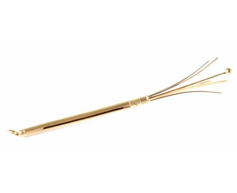 A George VI hallmarked 9ct gold swizzle stick/cocktail stirrer, engine turned body and plain slide collar, maker WM Ltd, Birm