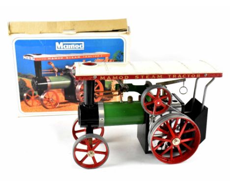 A boxed Mamod steam tractor with vaporizing spirit lamp funnel, detachable steering extension and paperwork. CONDITION REPORT
