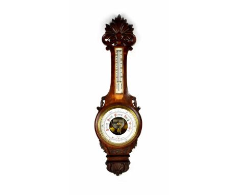 Morath Brothers; a late Victorian carved oak aneroid barometer/thermometer, stamped verso 'Registration No. 541964', length 9