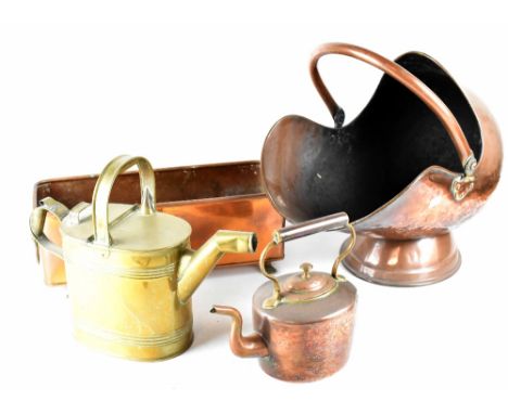Various copper and brass ware comprising a helmet-form coal scuttle, bed pan, oil can, planter with lion head ring handles, t