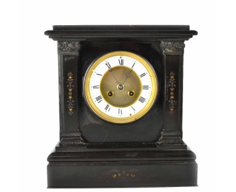 A late Victorian black slate eight-day mantel clock, the gilded and silvered dial set with Roman numerals, height 31cm. CONDI