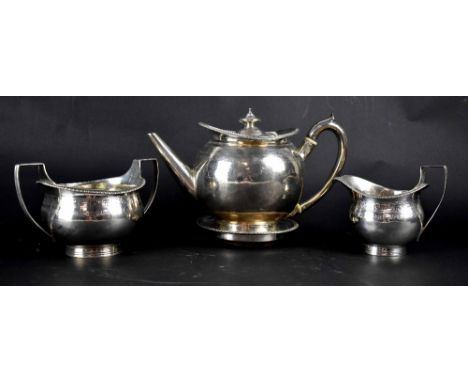 A George III hallmarked silver three-piece tea service with engraved Greek Key design and a matching teapot stand, height of 