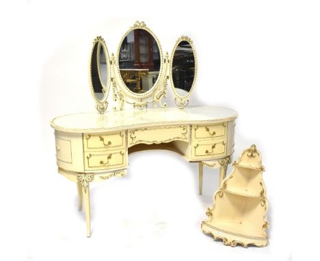 A modern French-style cream painted dressing table with glass inlaid kidney-shaped top fitted with triple mirror and with fou