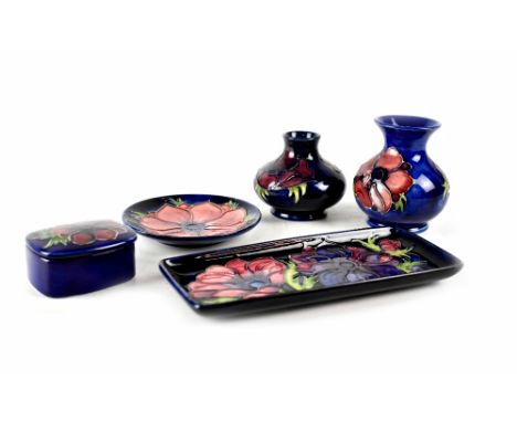 Two Moorcroft vases to include one squat baluster example, a baluster example, height of largest 10cm,  all in cobalt blue gr
