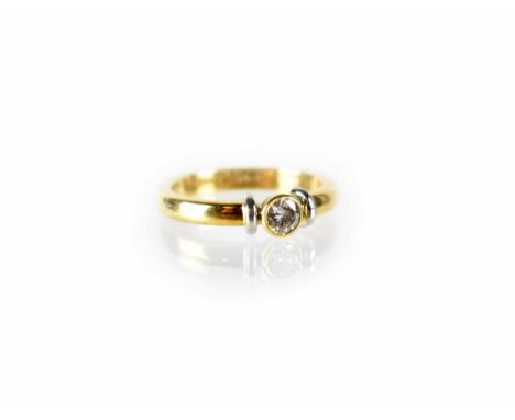 An 18ct yellow gold collet set diamond solitaire ring, size K, approx 4.2g.