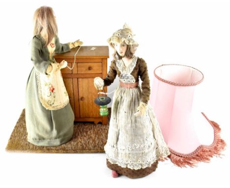 Josefina De Vasconcellos (1904-2005); two handmade doll arrangements, one depicting lady at wooden cabinet with string of pea