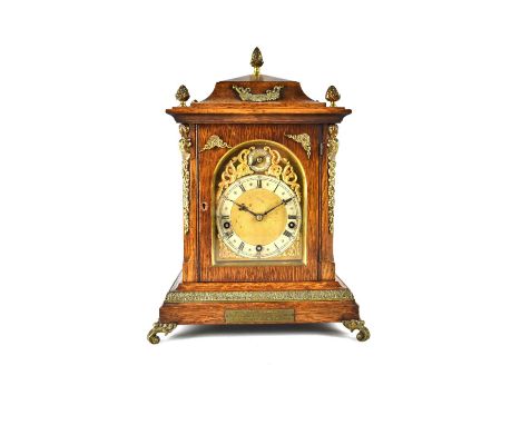 Winterhalder &amp; Hofmeier; a late 19th century oak cased eight-day chiming mantel clock with brass presentation plaque insc