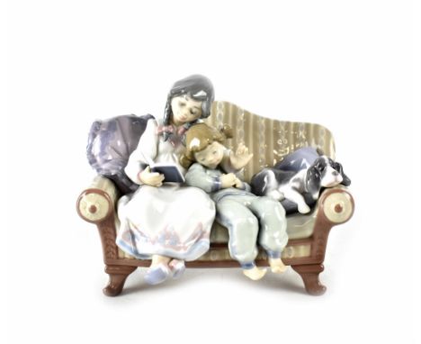 A Lladró figure group of children and dog on sofa, 21cm. CONDITION REPORT  Impressed no. 5735. No apparent damage or restorat