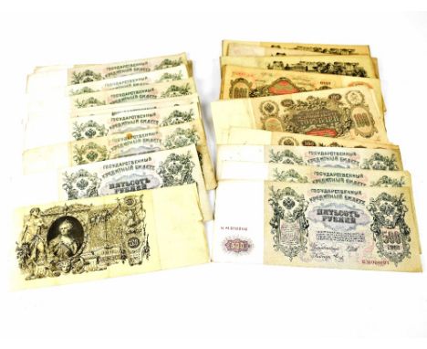 A collection of vintage Russian banknotes to include 100 rubles 1910 notes (x73), 500 rubles 1912 notes (x19) (92). CONDITION