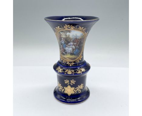 A small vase in a deep blue glaze adorned with gilt flowers, and a polychrome portrait of a 18th century French family holdin