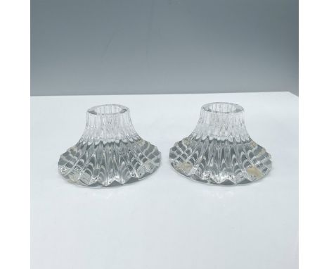 Elegant clear crystal glass single light candlestick duo in the Massena No Trim pattern. Baccarat Backstamp. Dimensions: 2''H