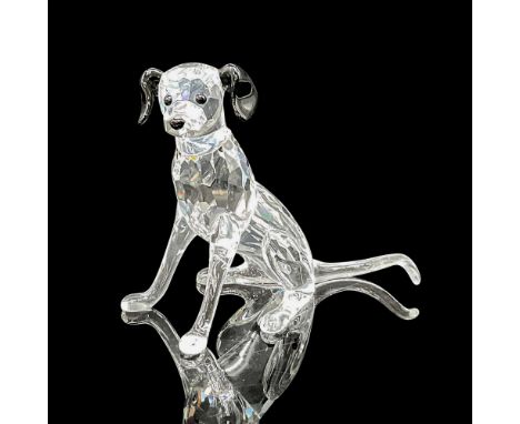 Clear crystal figure accented with black crystal eyes, ears, nose and spots on back, sitting on all fours. Swarovski backstam