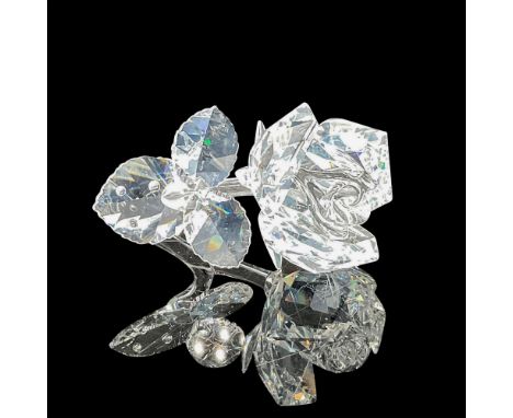 Clear crystal figural with detailed petals with clear smooth stem and simulated water drops. 7478 NR 000 001. Swarovski backs