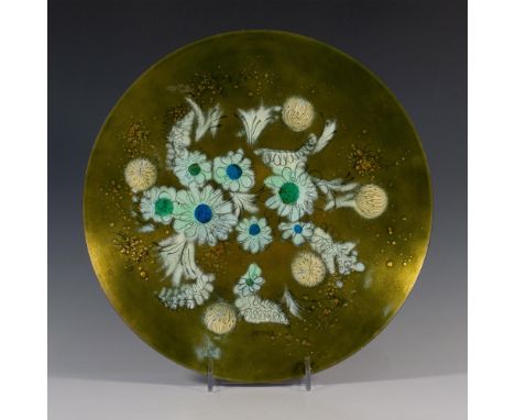 Original deep green floral enamel on copper decorative hanging plate by American designer Sascha Brastoff. Signature on lower