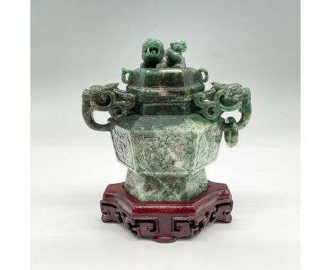 Jadeite lidded vessel with foo dogs on lid and handles. Includes wood stand; 4.5"L x 3.25"W x 1.25"H. Dimensions: 5.75"L x 3.