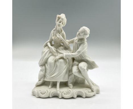 White glazed porcelain figure of a lady and young man sitting on a bench chatting. Blue crown with letter N mark. Impressed G