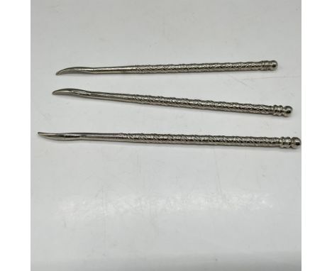 This old-world tool is used to nudge the meat of the nut out of the shell. Handles have ornate design with smooth pick. Unmar