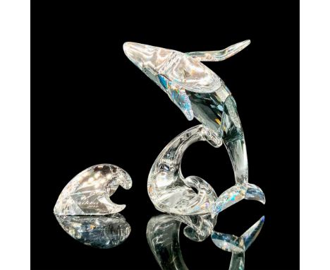 Signed Swarovski Crystal Figurine and Plaque, Paikea Whale. This is a pale blue crystal figure that depicts a whale in a mid-