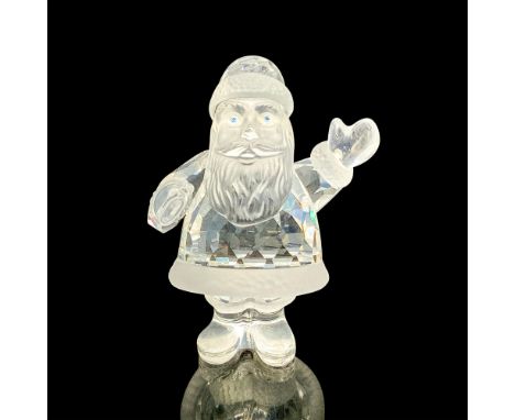 This retired Swarovski crystal Santa Claus was part of the Exquisite Accents collection and is made from faceted clear and fr