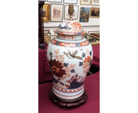 A ceramic table lamp in the form of an Imari vase and cover. 20'' high