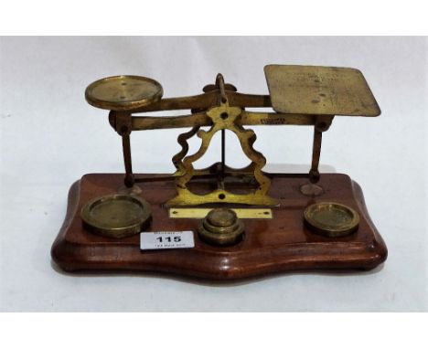 A set of Victorian gilt brass and mahogany postal scales with weights
