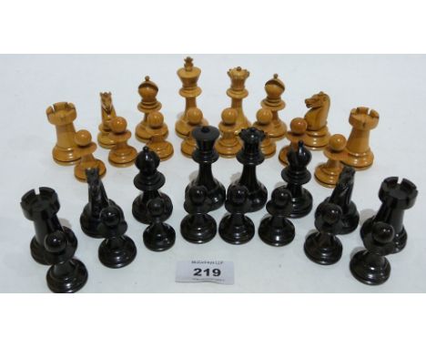 A turned ebonised and natural wood chess set. Height of King 3''. Complete. No board.