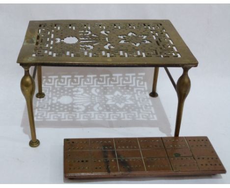 A brass pierced footman and a copper cribbage board