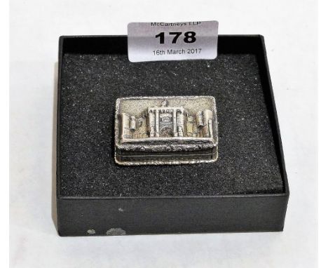 A George IV silver 'castle top' vinaigrette by Nathaniel Mills with gilded interior and grill, the lid with unidentified cast