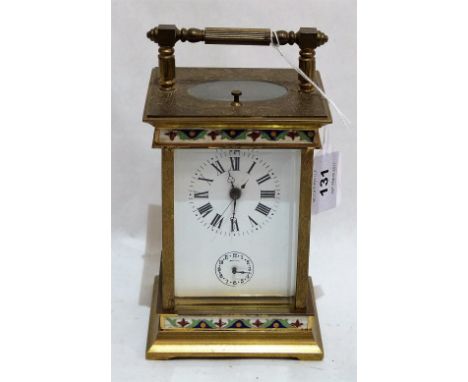 A brass and cloisonné enamel carriage clock with repeater and alarm, striking the hours and half hours on a bell. 6'' high