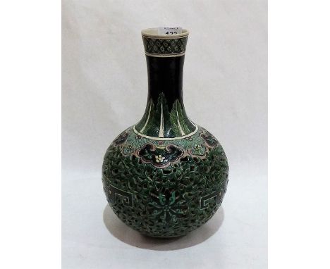 A Chinese famille-noir reticulated bottle vase, decorated in shades of green with lappets, ruyi and meandering foliage, diape