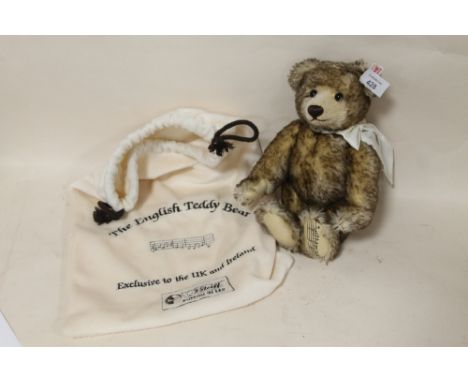 A MUSICAL STEIFF TEDDY BEAR, PLAYING THE USA NATIONAL ANTHEM, IN DRAWSTRING BAG