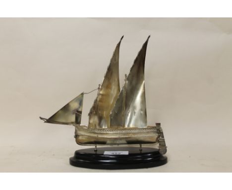 A CONTINENTAL STYLE STERLING SILVER MODEL OF A SAIL SHIP RAISED ON EBONISED PLINTH STAMPED 925