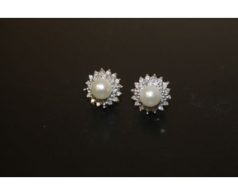 A PAIR OF UNMARKED DIAMOND AND FAUX PEARL EARRINGS