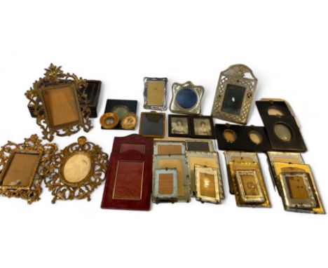 A group of small antique and vintage picture frames Comprising of two pairs of ebonised acorn frames, two red leather frames,