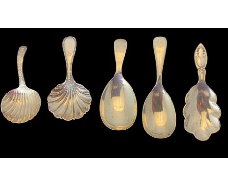 A group of five silver caddy spoons
Comprising of a caddy spoon with leaf shaped bowl, A.Marston &amp; Co., Birmingham, 1930,