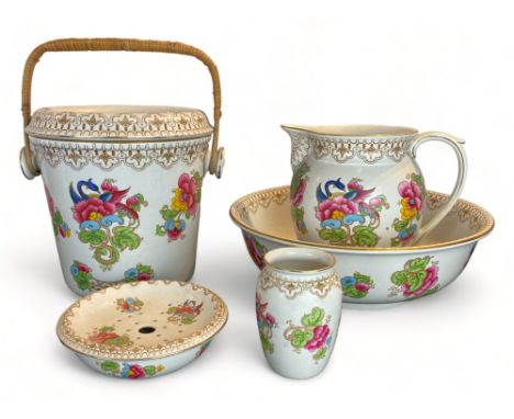 A Keeling &amp; Co. Losol Ware Magnolia wash stand set
Comprising of a pitcher and bowl, soap dish, vase and slop bucket, the