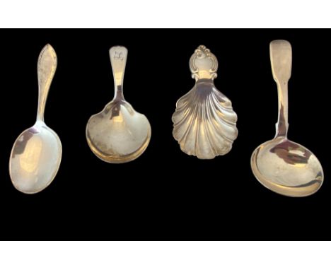 A group of four silver caddy spoons
Comprising of a shell shaped spoon, Alexander Hunt, Sheffield 1846, a small caddy spoon, 