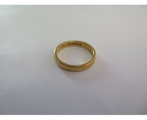 A 22ct yellow gold plain 3.3mm wedding band - hallmarked, stamped 0.22 - ring size Q - weight approx 5 grams 