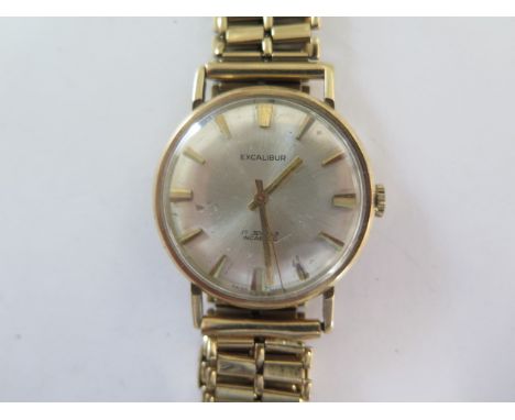 A gents 9ct yellow gold manual wind Excalibur presentation wristwatch on a 9ct strap - 33mm case - total weight approx 54 gra
