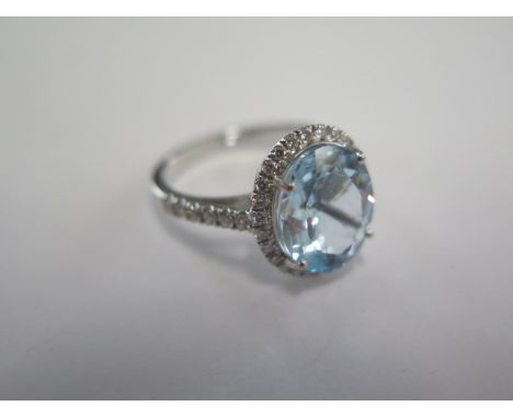 An 18ct white gold aquamarine and diamond ring, aquamarine is approx 4.50ct, head size approx 15mm x 13mm, size N, diamonds b