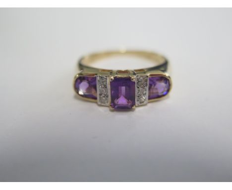 A 9ct yellow gold amethyst and diamond ring, head size approx 18mm x 6mm, good colour amethyst, size K, diamonds bright and l