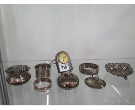 A silver shell dish, a silver pot, a silver cased bedside clock (not working) and 5 other pieces of silver, total weighable s